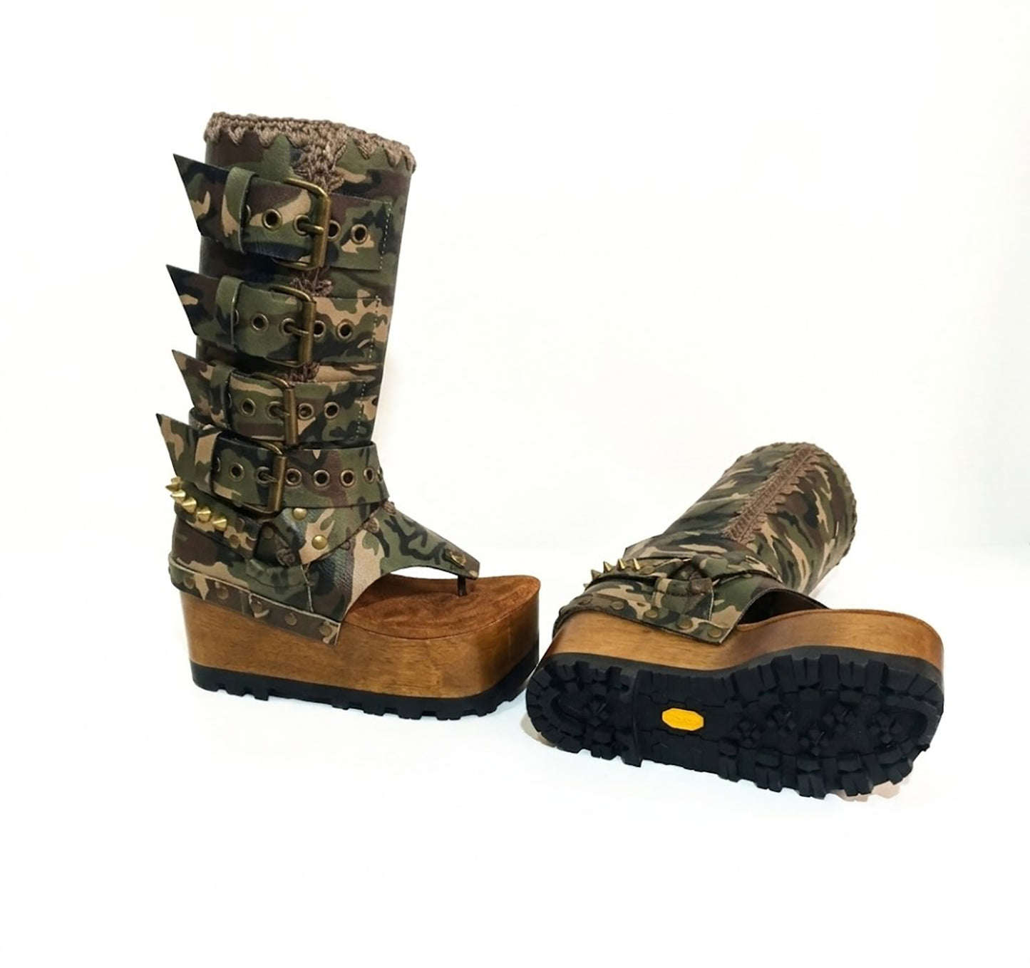 Handmade Alabama Flip Flops Army Boots in camouflage leather, featuring old gold pyramid studs, a wooden wedge, and a black Vibram tractor sole.