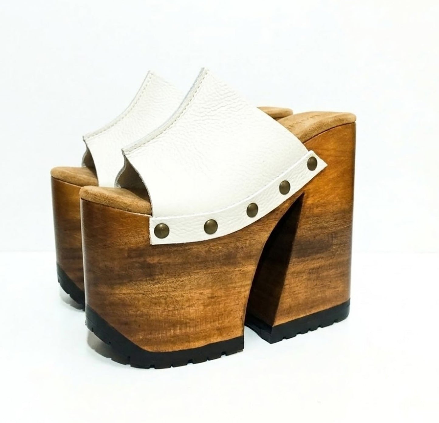 Side view of White Luxury Queen Sandals by Sol Caleyo featuring 17cm bell-style wooden heel and 11cm hand-carved platform. High-end handcrafted white leather platform sandals with vintage studs and padded goatskin suede insole. Artisanal luxury footwear for women, 100% handmade.