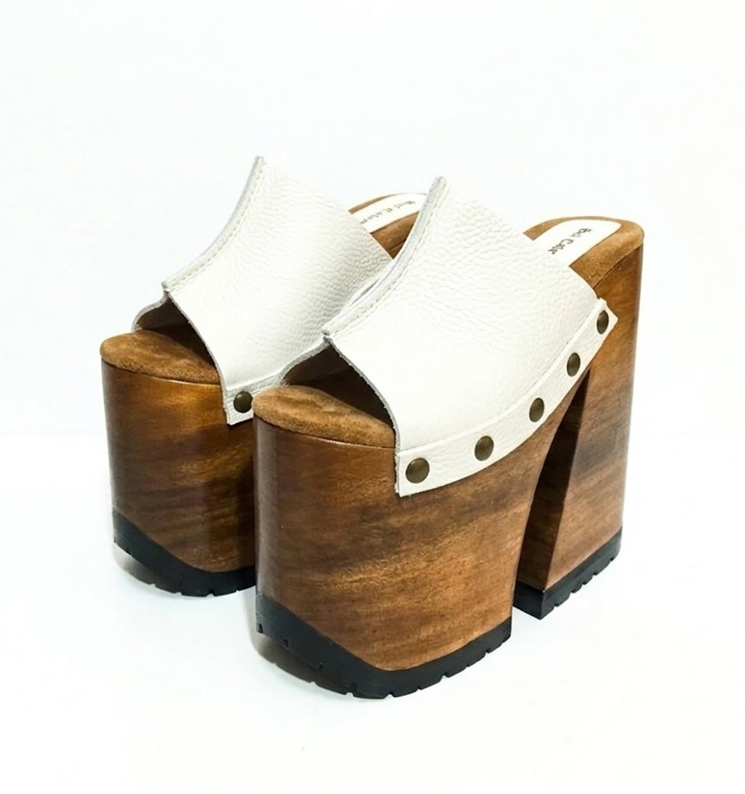 Side view of White Luxury Queen Sandals by Sol Caleyo featuring 17cm bell-style wooden heel and 11cm hand-carved platform. High-end handcrafted white leather platform sandals with vintage studs and padded goatskin suede insole. Artisanal luxury footwear for women, 100% handmade.