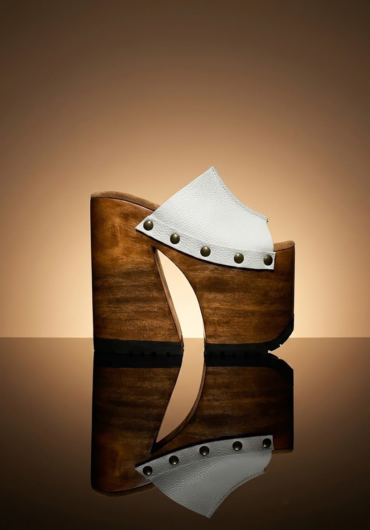 Side view of White Luxury Queen Sandals by Sol Caleyo featuring 17cm bell-style wooden heel and 11cm hand-carved platform. High-end handcrafted white leather platform sandals with vintage studs and padded goatskin suede insole. Artisanal luxury footwear for women, 100% handmade.