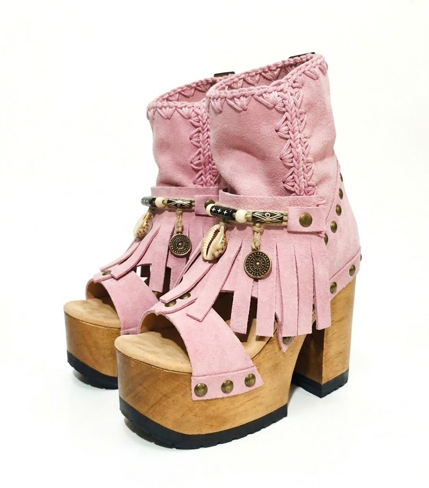 Sol Caleyo Pink Aruba Boots: handmade pink suede platform sandals with wooden heel and bohemian shell and coin decorations.