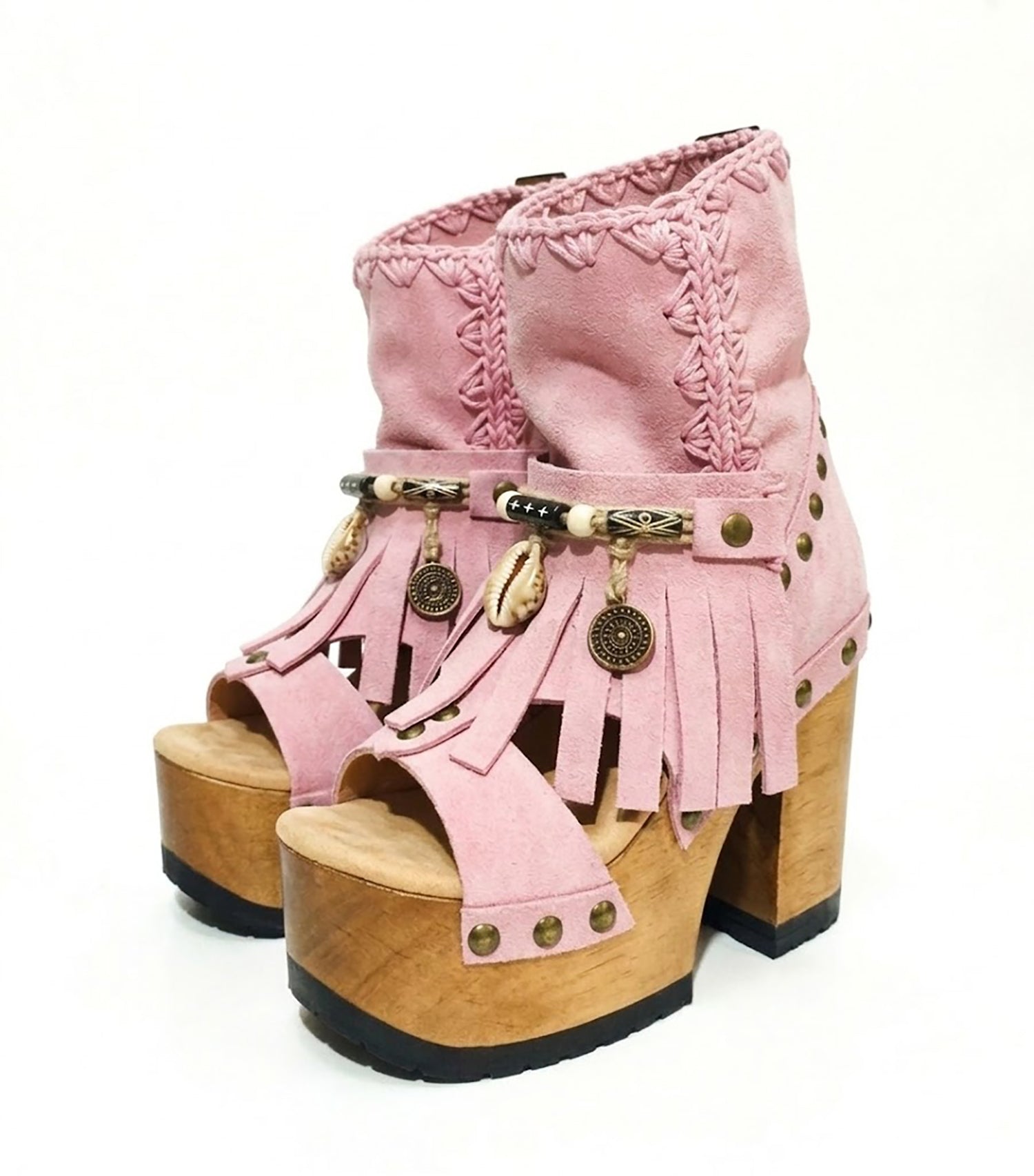Sol Caleyo Pink Aruba Boots: handmade pink suede platform sandals with wooden heel and bohemian shell and coin decorations.