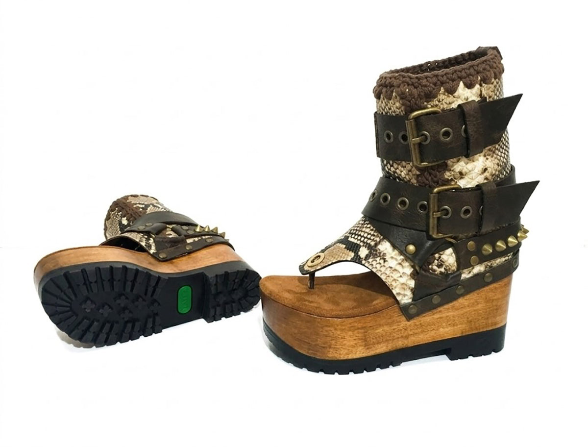 Sol Caleyo Kenya Flip Flop Snake Boots: handmade python print leather platform sandals with brown buckled straps and wooden tractor sole.