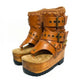 Sol Caleyo Kenya Flip Flop Camel Boots: handmade camel leather platform sandals with wooden wedge and old gold biker embellishments.