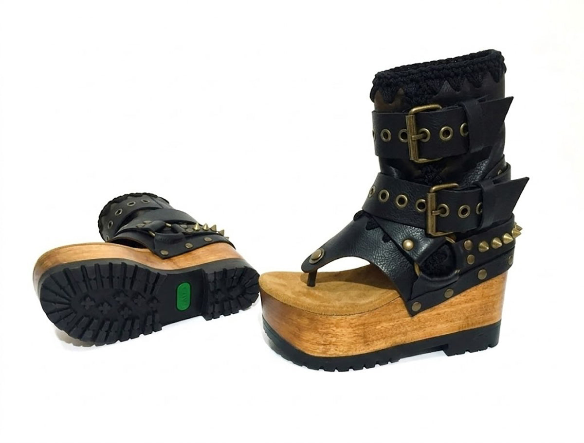 Sol Caleyo Kenya Flip Flop Black Boots: handmade black leather platform sandals with wooden wedge, tractor sole, and old gold biker buckles.
