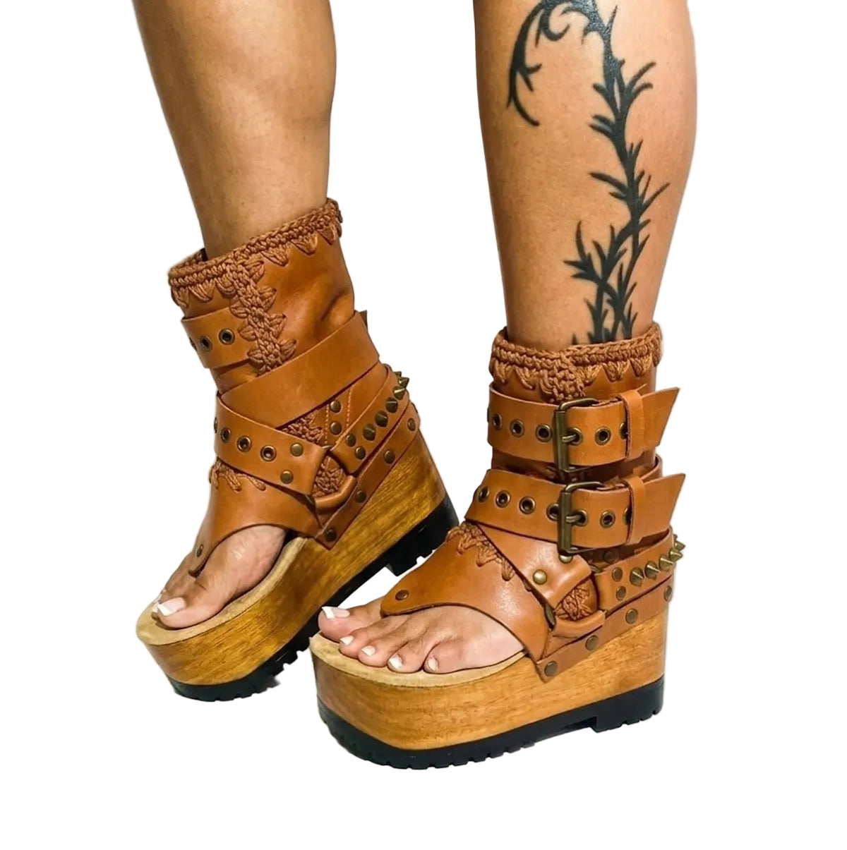 Model wearing the Kenya Flip Flop Camel Boots by Sol Caleyo, showcasing the warm camel leather and chunky wood platform in a summer boho look.