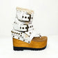 Sol Caleyo Kenya Flip Flop White Boots: handmade white leather platform sandals with wooden wedge, tractor sole, and gold biker buckles.