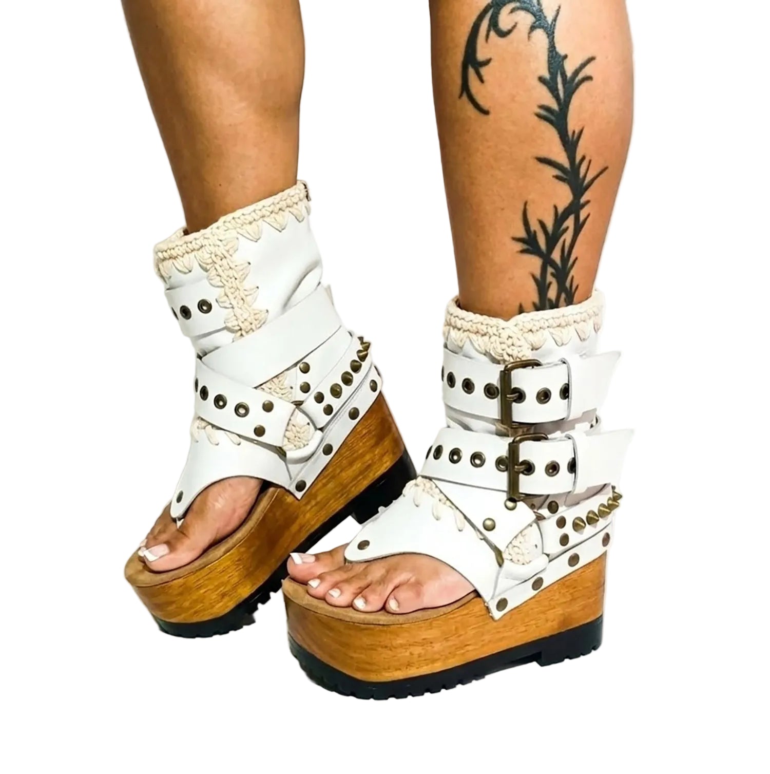 Fashion model styling the Kenya Flip Flop White Boots by Sol Caleyo, featuring white leather, crochet details, and high wooden platforms.