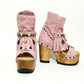 Sol Caleyo Pink Aruba Boots: handmade pink suede platform sandals with wooden heel and bohemian shell and coin decorations.
