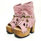 Sol Caleyo Pink Aruba Boots: handmade pink suede platform sandals with wooden heel and bohemian shell and coin decorations.