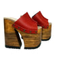 Red Luxury Queen Sandals by Sol Caleyo, featuring vibrant red leather, a massive 17 cm bell-shaped wooden heel, and an 11 cm platform with a black rubber track sole