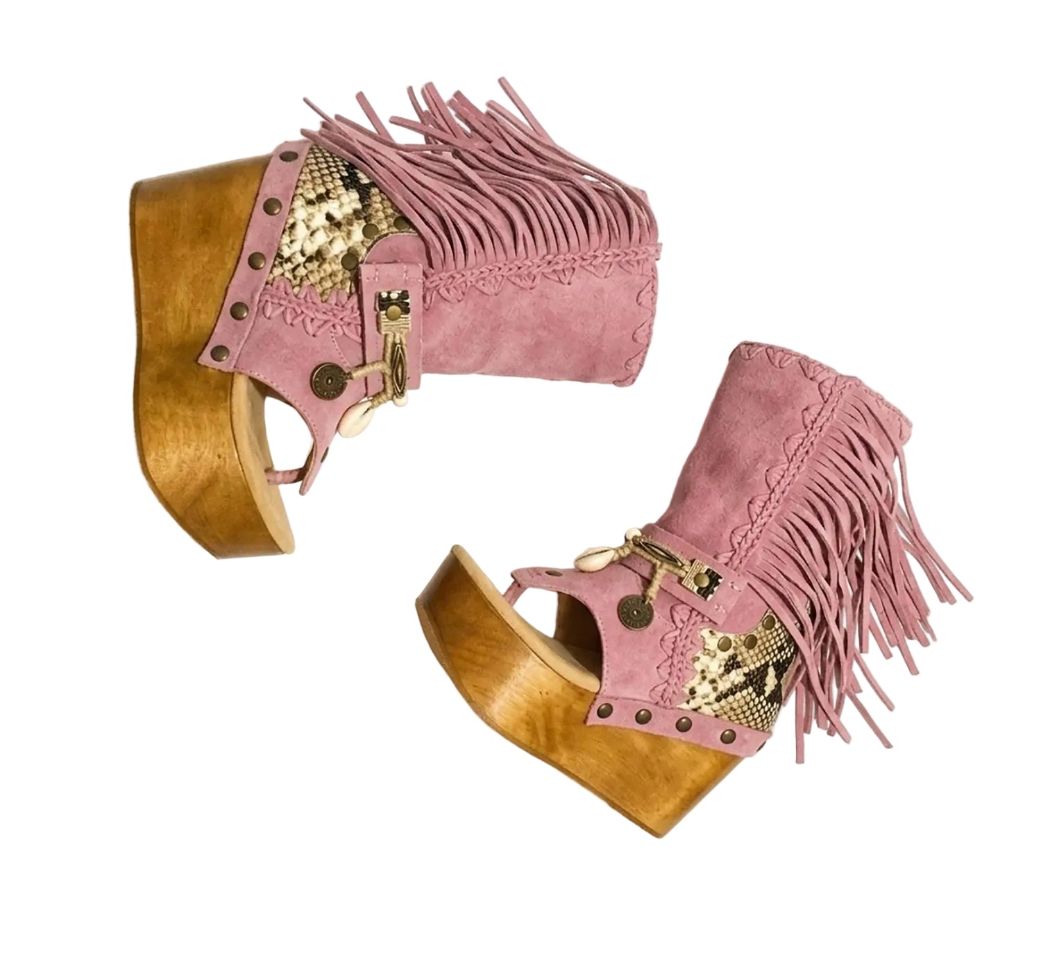 Handmade Atenea Pink Flip Flop Boots by Sol Caleyo, featuring pink suede leather, fringe details, shells, vintage coins, and a high wooden platform sole on a white background
