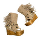 Atenea Flip Flop Boots by Sol Caleyo in neutral beige suede, featuring boho fringes, shell decorations, snake-print heel, and a tall wooden platform sole.