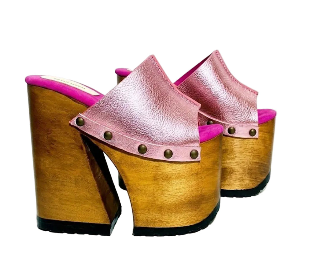 Side view of Sol Caleyo Pink Luxury Queen Sandals featuring metallic pink leather, bronze studs, and a high architectural wooden platform heel against a white background.