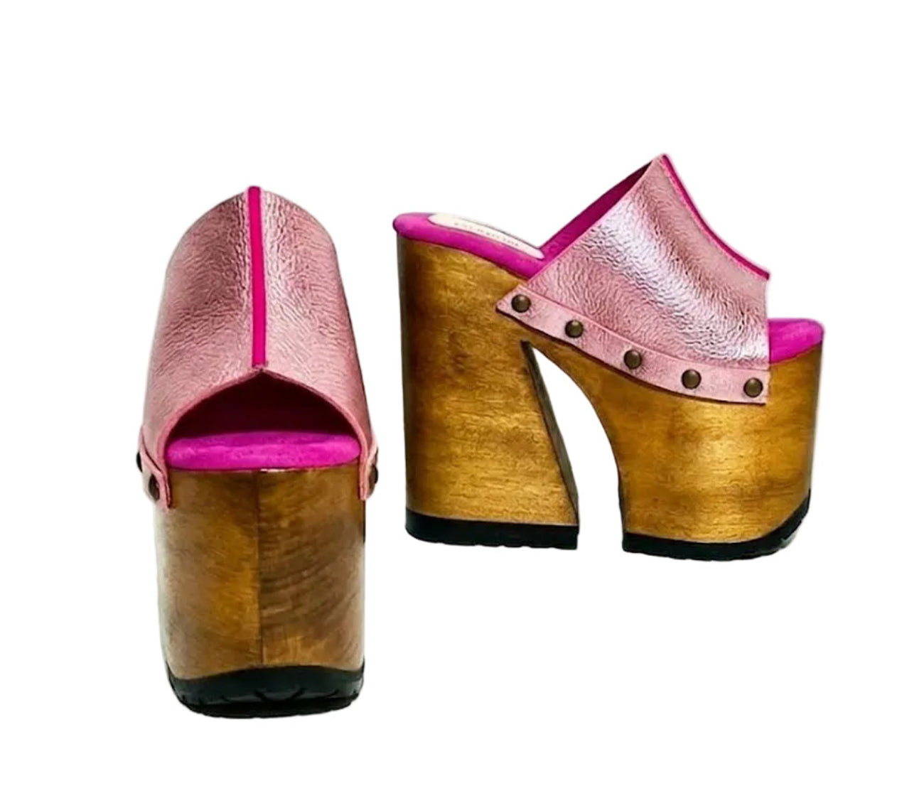 Side view of Sol Caleyo Pink Luxury Queen Sandals featuring metallic pink leather, bronze studs, and a high architectural wooden platform heel against a white background.