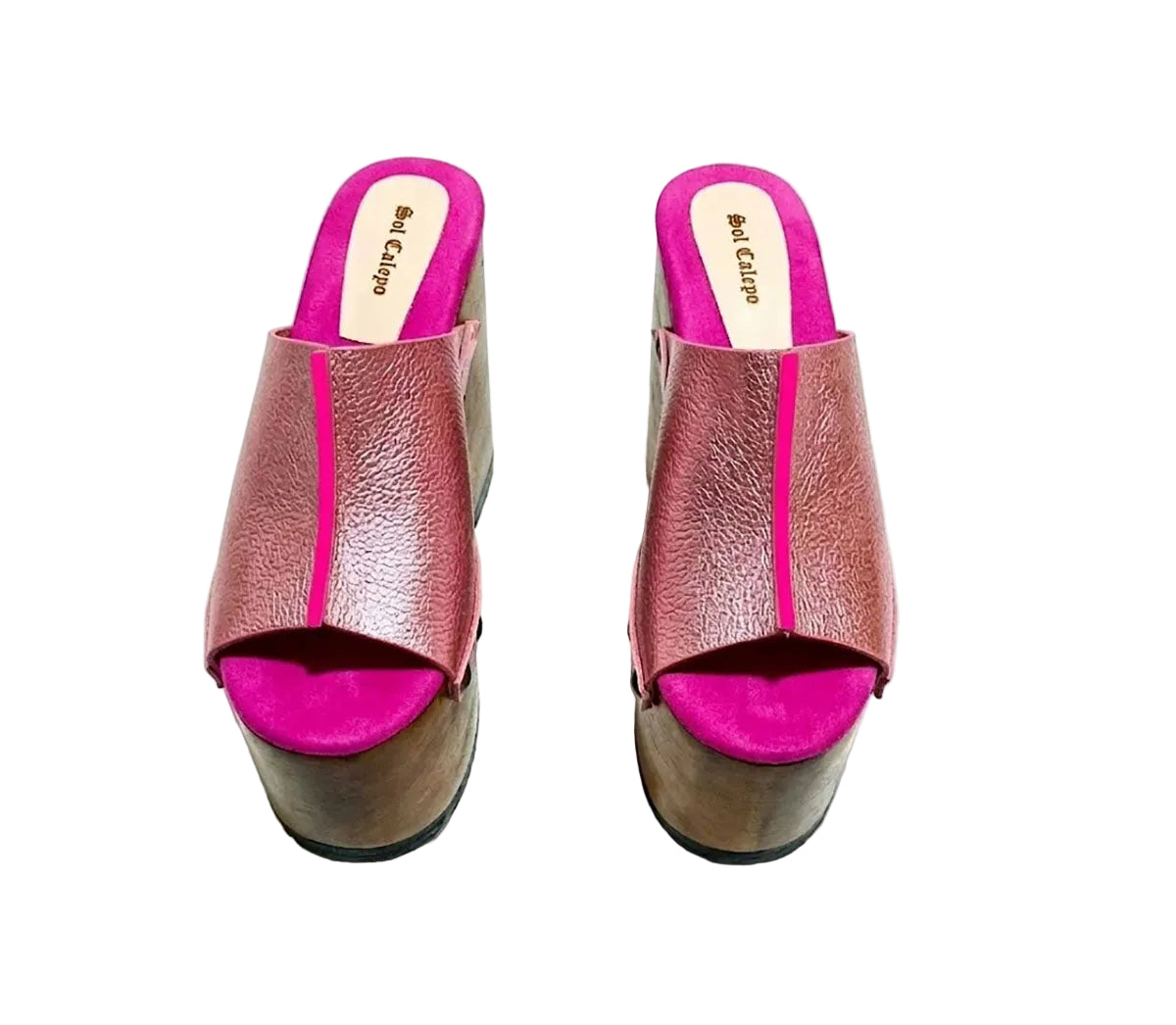 Side view of Sol Caleyo Pink Luxury Queen Sandals featuring metallic pink leather, bronze studs, and a high architectural wooden platform heel against a white background.