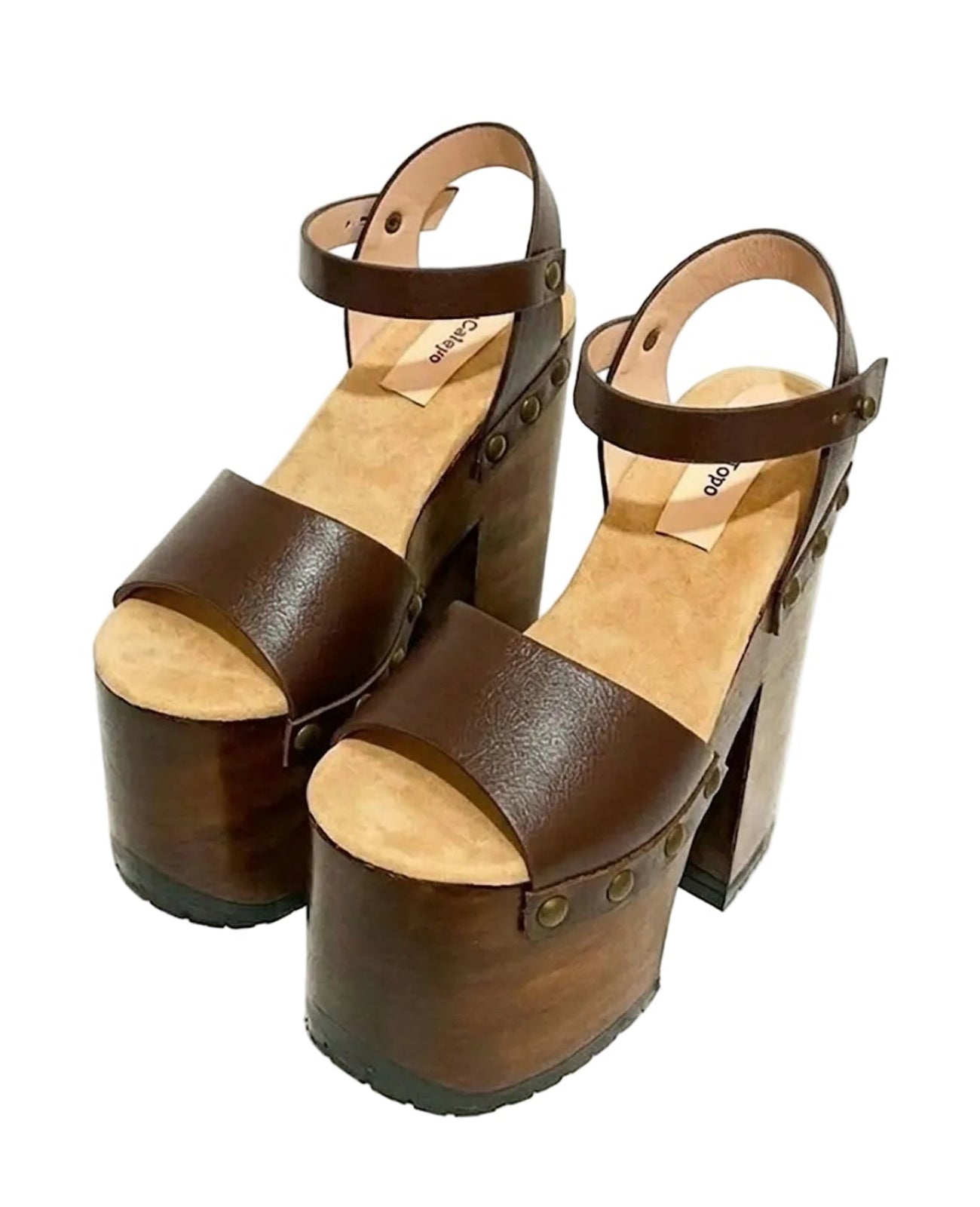 Side view of Sol Caleyo Crazy Brown Sandals featuring deep brown leather straps, ankle closure, and a 17 cm hand-carved wooden platform heel with bronze studs.