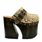 High-angle view of Route 66 XL snake print leather clogs featuring an extreme 17cm wooden heel and 11cm platform.