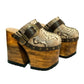 Profile view of Route 66 XL Snake Natural clogs with 17cm natural wood platform heel, snake print leather, and antique brass buckle.