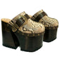High-angle view of Route 66 XL snake print leather clogs featuring an extreme 17cm wooden heel and 11cm platform.