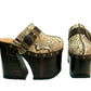 High-angle view of Route 66 XL snake print leather clogs featuring an extreme 17cm wooden heel and 11cm platform.