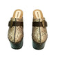 High-angle view of Route 66 XL snake print leather clogs featuring an extreme 17cm wooden heel and 11cm platform.