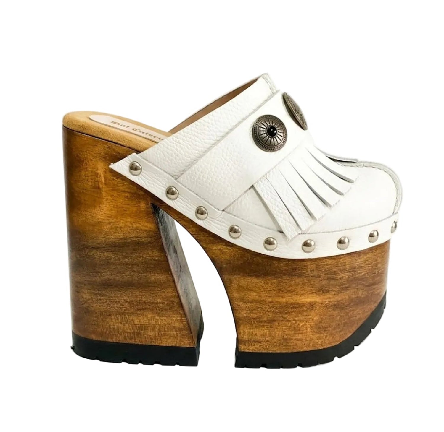 Side view of White Indian Clogs XL featuring extreme 17cm natural wood platform, white leather fringes, and antique silver metal conchos.