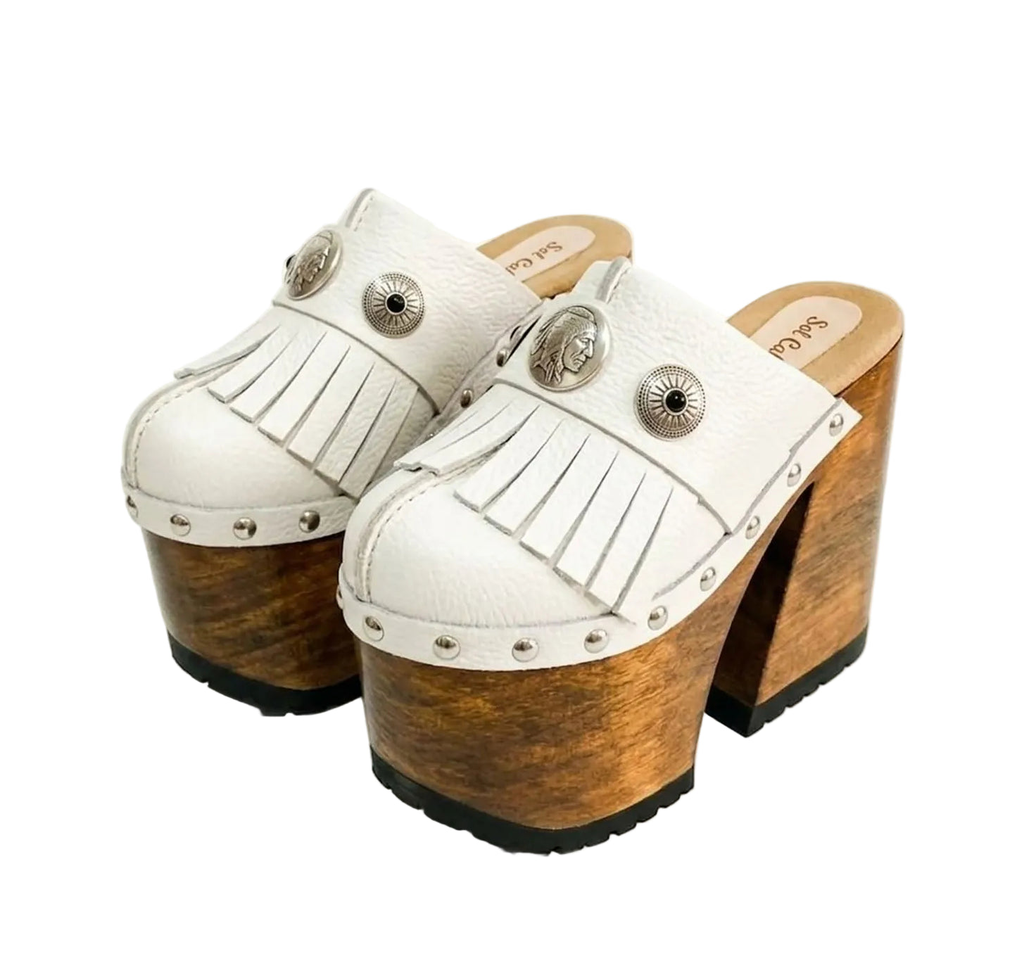 Side view of White Indian Clogs XL featuring extreme 17cm natural wood platform, white leather fringes, and antique silver metal conchos.
