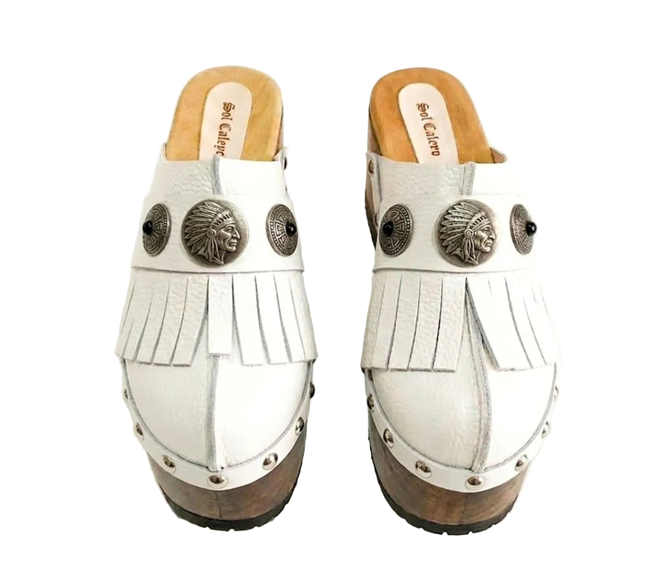 Side view of White Indian Clogs XL featuring extreme 17cm natural wood platform, white leather fringes, and antique silver metal conchos.