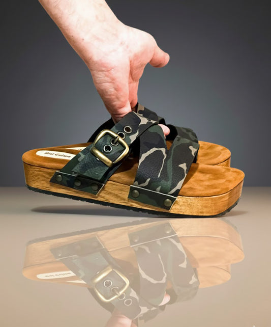 Handmade men’s camouflage leather clog sandals with wooden sole and black Vibram outsole by Sol Caleyo.