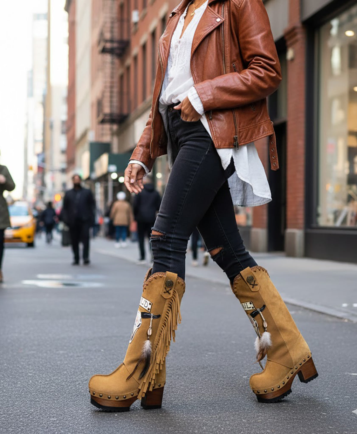 Camel suede cowboy boots. Clogs with hand-painted buffalo head, feathers, and fringes. Bohemian-style boots. High-end footwear handmade by Sol Caleyo.