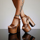 Handcrafted brown leather clogs sandals with wooden soles, high platforms, and heels