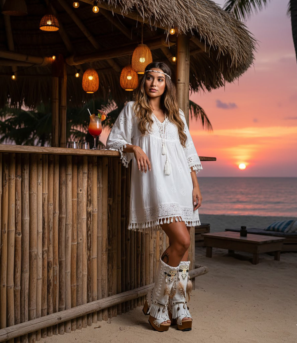 Hand-painted Buffalo platform sandals by Sol Caleyo in premium suede, featuring artisan bohemian motifs, feathers, and shells on a 12cm lacquered wooden heel.