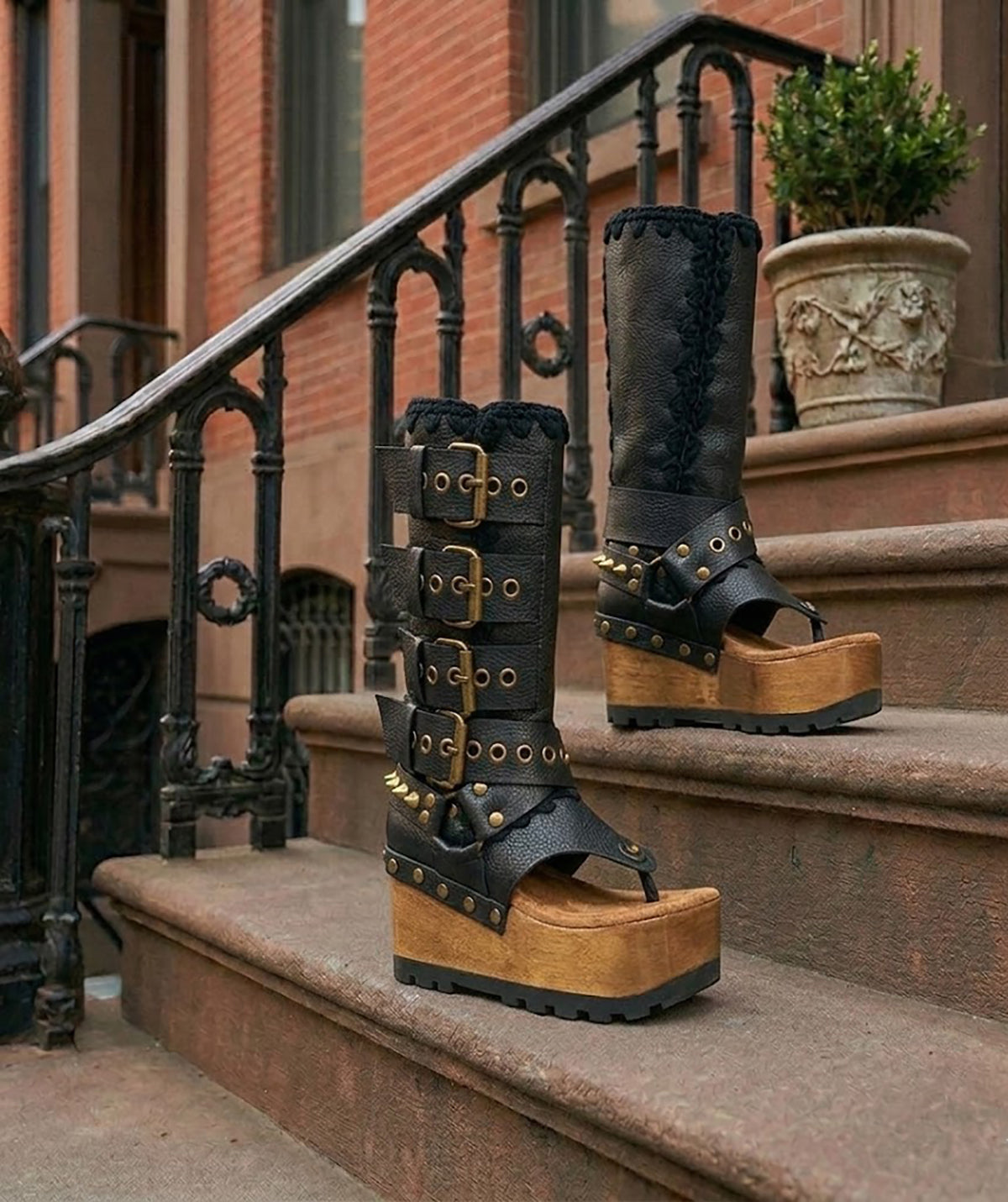 Luxury handmade Alabama Flip Flops Black Boots in black leather, showing the 10 cm wooden wedge, Vibram tractor sole, and old gold pyramid stud details.