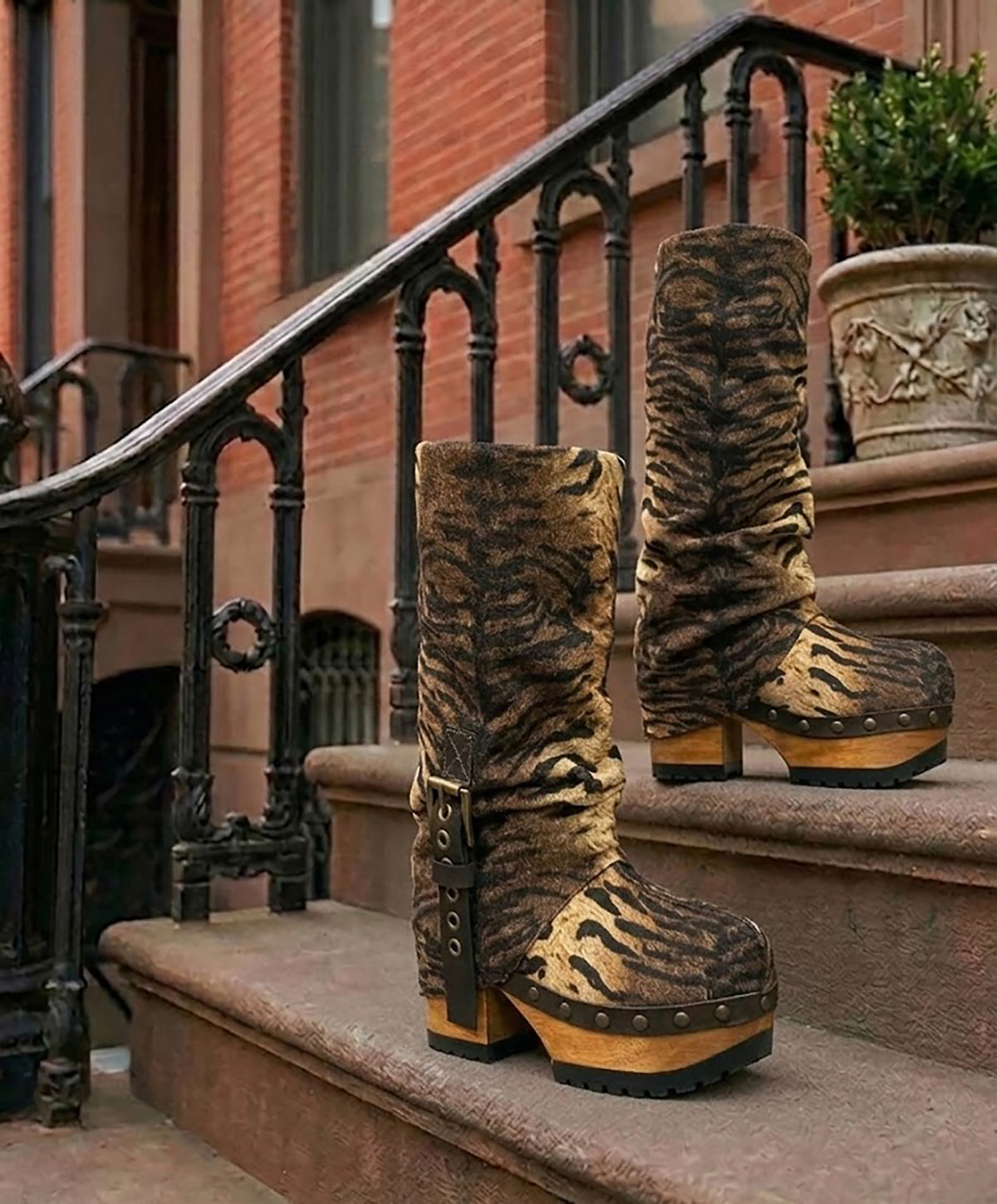 Sol Caleyo Tiger Boots - Handcrafted tiger-print suede boots with 3.5-inch wooden platform and antique gold buckle.
