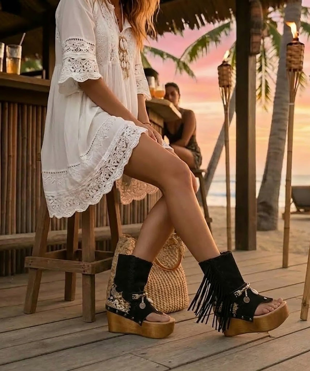 Artisanal handmade suede flip-flop platform sandals on model. Features lightweight 10 cm wooden sole, 3.5 cm platform, and vintage-inspired shell accents. Sustainable slow fashion footwear by Sol Caleyo available in sizes 35-47.