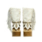Atenea White Flip Flop Boots by Sol Caleyo, featuring premium white suede, bohemian fringe, shell decorations, and a chunky wooden platform heel against a white background.
