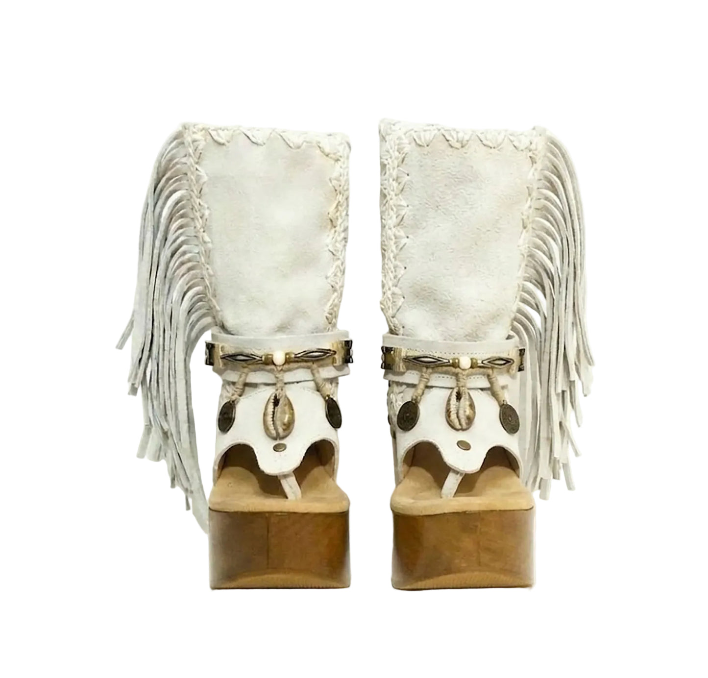 Atenea White Flip Flop Boots by Sol Caleyo, featuring premium white suede, bohemian fringe, shell decorations, and a chunky wooden platform heel against a white background.