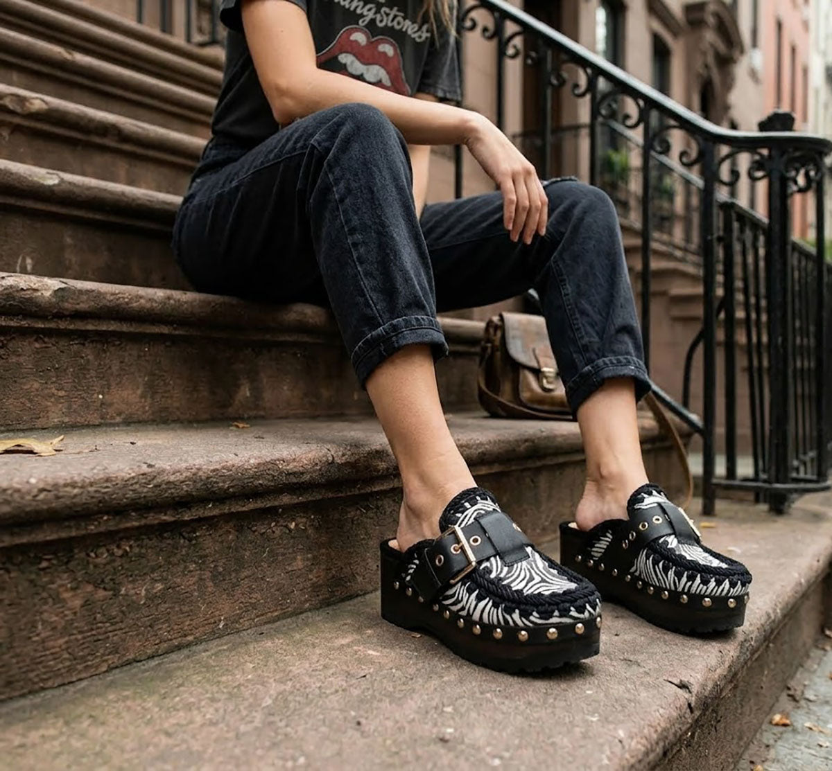 Model wearing Sol Caleyo Zebra Oxford Clogs with a 6 cm heel and 5 cm platform, showcasing the zebra-patterned leather and sophisticated bohemian style.