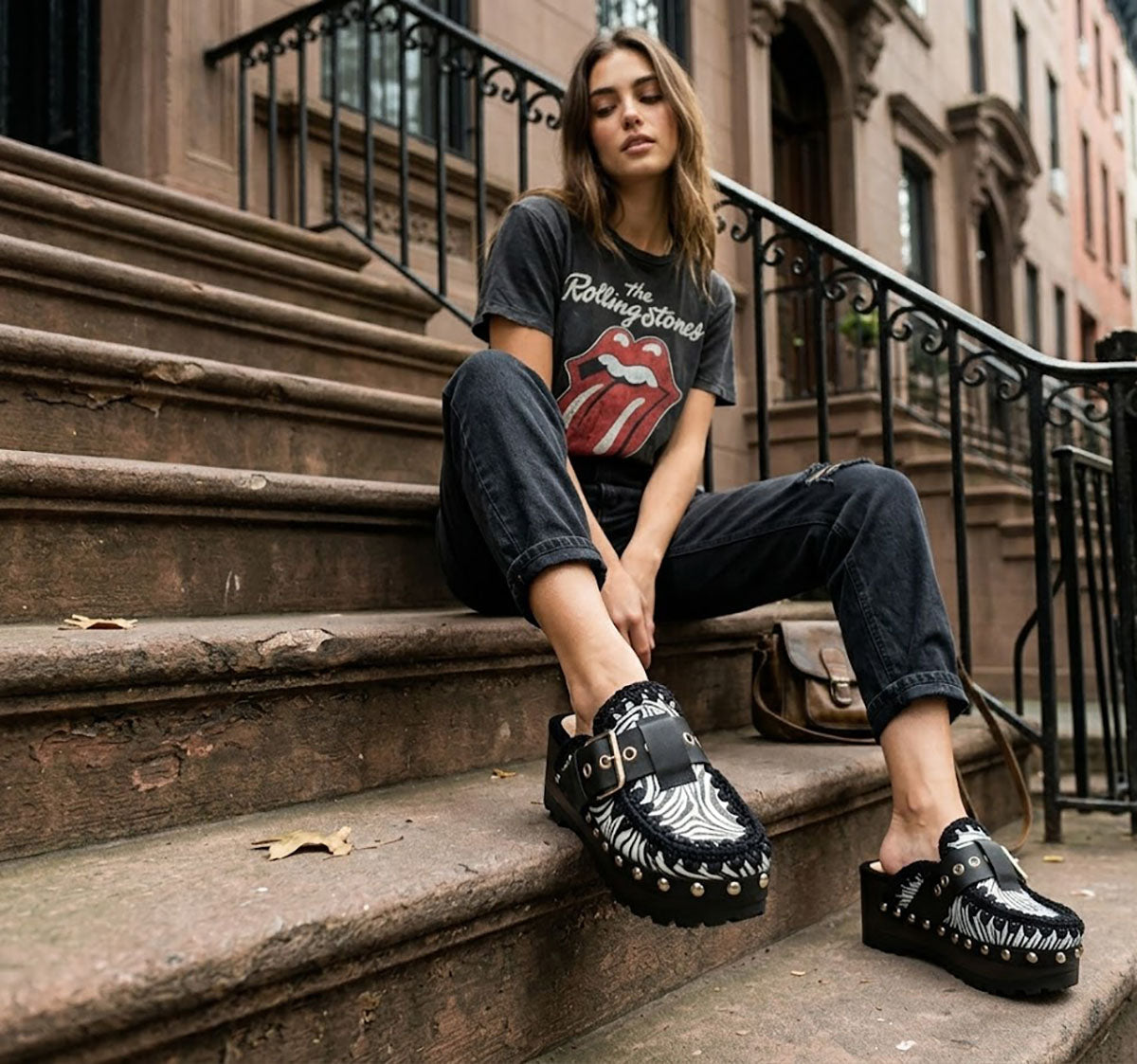 Model wearing Sol Caleyo Zebra Oxford Clogs with a 6 cm heel and 5 cm platform, showcasing the zebra-patterned leather and sophisticated bohemian style.
