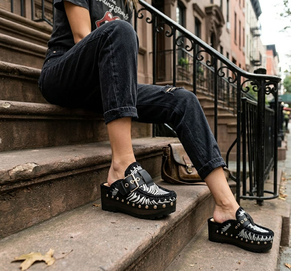 Model wearing Sol Caleyo Zebra Oxford Clogs with a 6 cm heel and 5 cm platform, showcasing the zebra-patterned leather and sophisticated bohemian style.