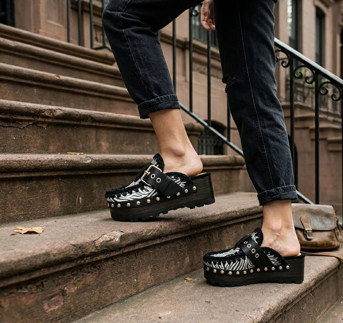 Model wearing Sol Caleyo Zebra Oxford Clogs with a 6 cm heel and 5 cm platform, showcasing the zebra-patterned leather and sophisticated bohemian style.