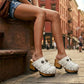 Model wearing Sol Caleyo White Indian Clogs featuring leather fringes and shells, styled for a high-end bohemian summer look.