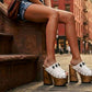 White leather sandal. White leather sandal boho style. White leather sandal decorated with fringes and silver conchos with a unique boho style. Wooden clog sandals with super high heels 70's style. Sizes 34 to 47. High quality handmade leather shoes by sol Caleyo. Sustainable fashion.