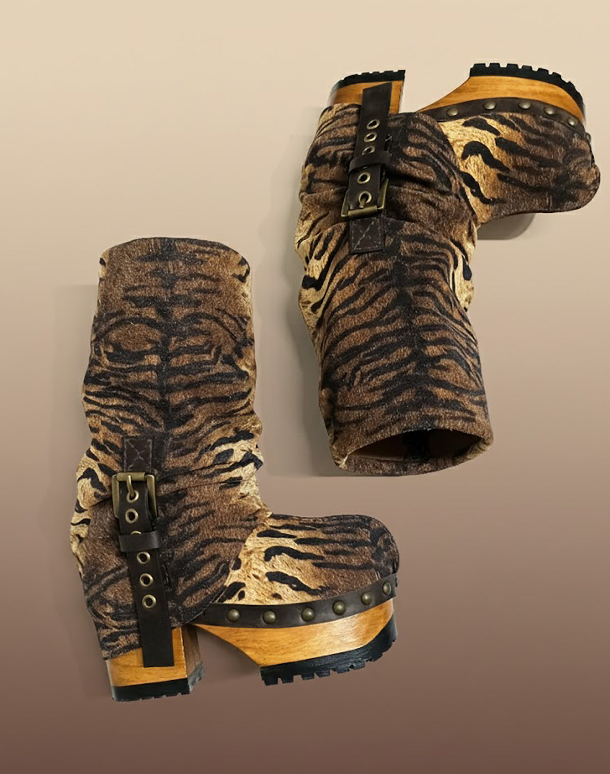 Sol Caleyo Tiger Boots - Handcrafted tiger-print suede boots with 3.5-inch wooden platform and antique gold buckle.