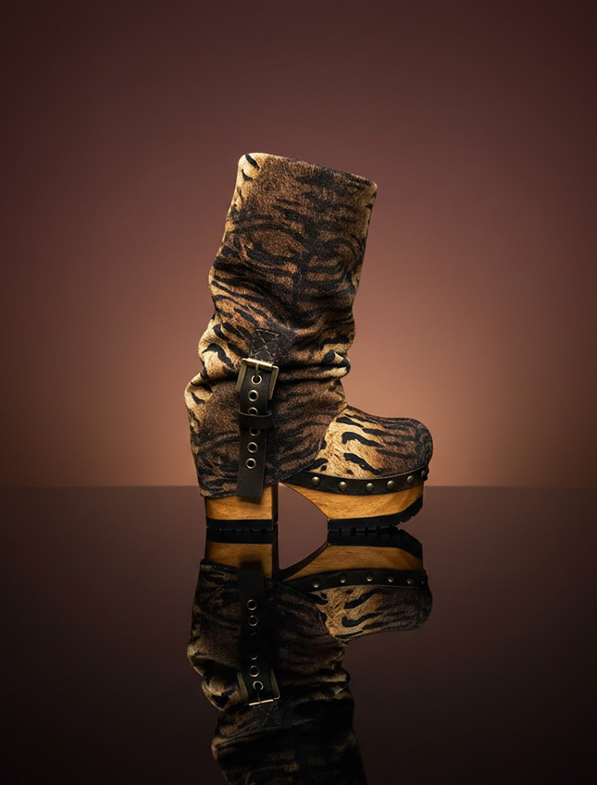 Sol Caleyo Tiger Boots - Handcrafted tiger-print suede boots with 3.5-inch wooden platform and antique gold buckle.