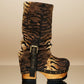 Sol Caleyo Tiger Boots - Handcrafted tiger-print suede boots with 3.5-inch wooden platform and antique gold buckle.