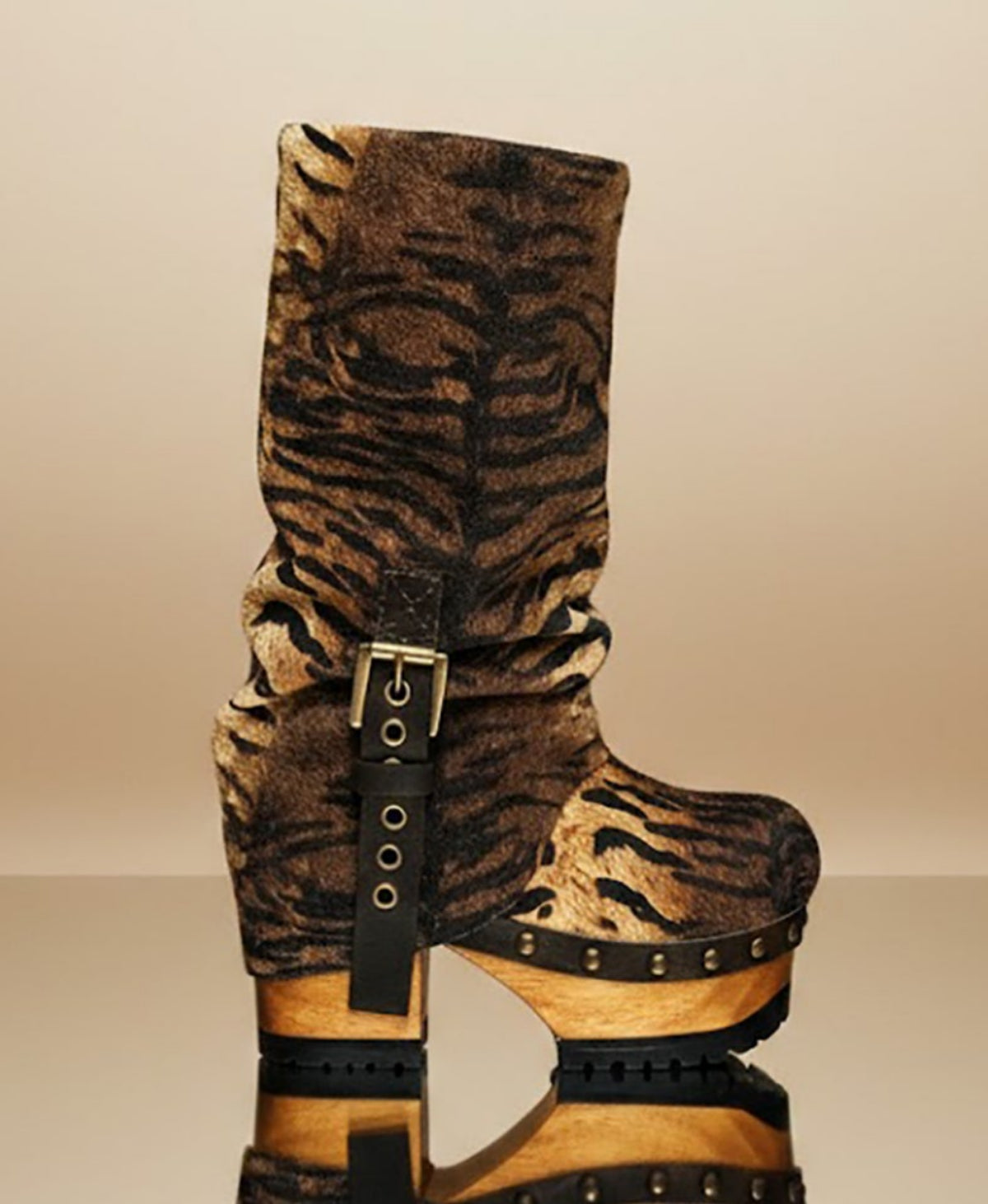 Sol Caleyo Tiger Boots - Handcrafted tiger-print suede boots with 3.5-inch wooden platform and antique gold buckle.