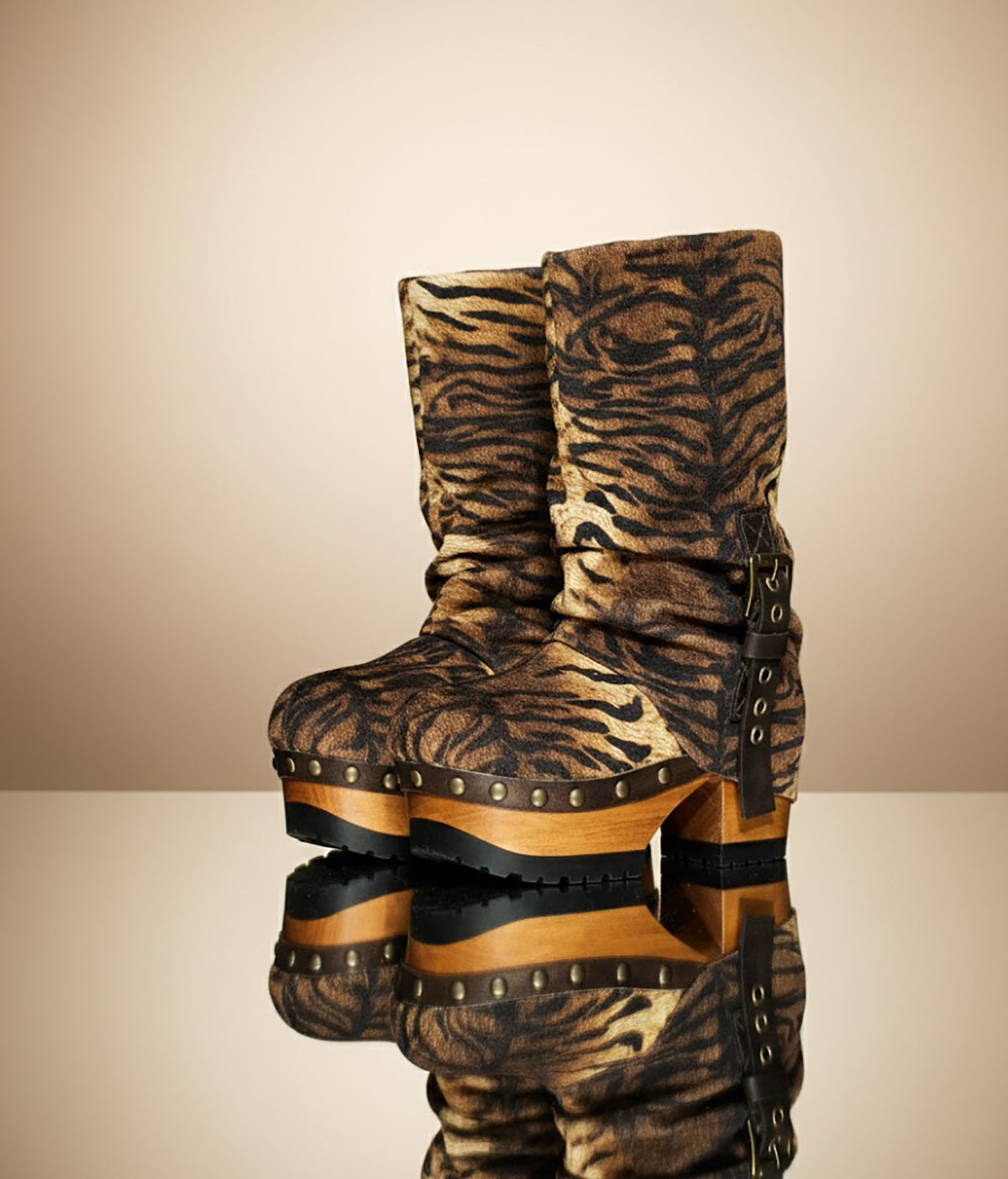 Sol Caleyo Tiger Boots - Handcrafted tiger-print suede boots with 3.5-inch wooden platform and antique gold buckle.