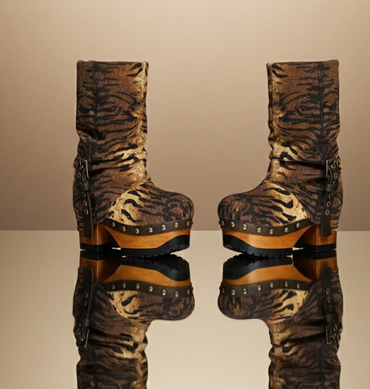 Sol Caleyo Tiger Boots - Handcrafted tiger-print suede boots with 3.5-inch wooden platform and antique gold buckle.